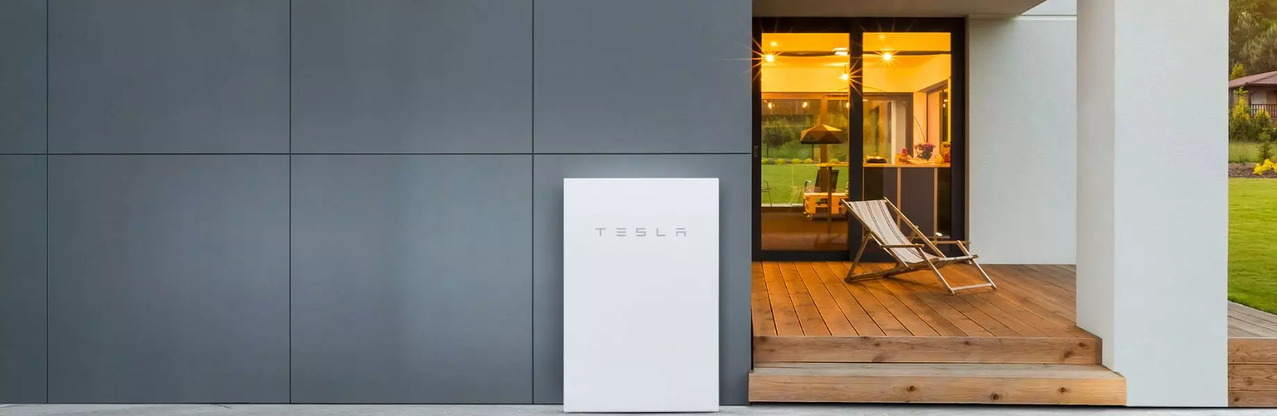 Tesla Powerwall installed on the exterior of a modern home